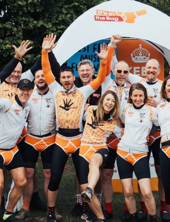 Fundraising team celebrating together at an It’s in the Bag charity event